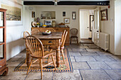 Rustic wooden dining table with chairs in a country house