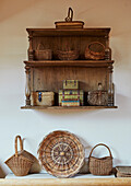 Antique wall shelves and collection of baskets