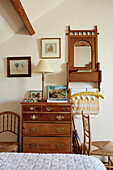 Antique chest of drawers in attic bedroom