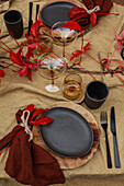 Autumnally set table with linen fabric