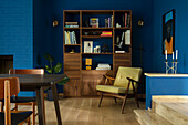 Wooden furniture and blue wall design in retro living room