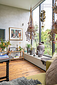 Living room with hanging baskets and decorative headboard