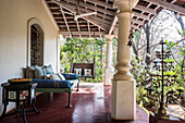 Colonial-style veranda with day bed and swing