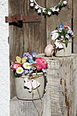 Spring bouquet with Easter decoration in DIY concrete pot