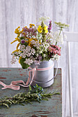 Bouquet of wild flowers in a zinc bucket