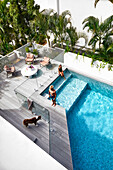 View from above to pool and terrace with glass partitions