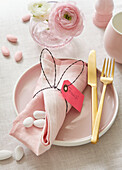Easter table setting with DIY bunny ears as napkin ring