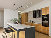 Contemporary kitchen with wooden fronts and kitchen island