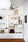 A white shelf in a living room