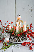 Metal stand Advent wreath with holly berries, twigs, and decorative birds
