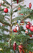 Christmas tree with candles and glass ornaments