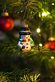 Christmas tree with glass snowman ornament (detail)
