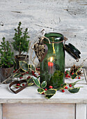 Hurricane light in vintage bow glass, heart-shaped cut-out filled with hemlock cones and holly