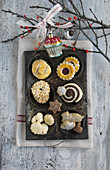 Old baking pan filled with assorted cookies with Christmas decorations