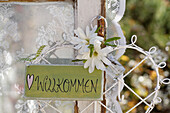 Welcome sign and metal heart with star magnolia