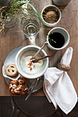 Breakfast set with cinnamon biscuits, yoghurt and coffee