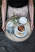 Breakfast tray with crockery, cinnamon biscuits and biscuits