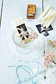 White candles bundled with border and black and white photo