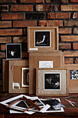 Black and white photos glued onto the back of picture frames