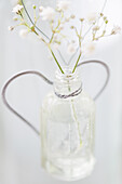 Flowers in a glass with heart decoration