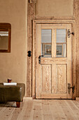 Rustic wooden door in rural room in earth tones