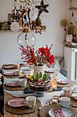 Christmas dining table with cake and bouquet of amaryllis