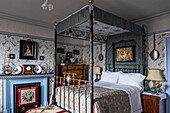 Four poster bed with decorative fabrics