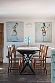 Pair of paintings by James Wedge flanking a wooden farmhouse style table