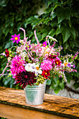 A late summer bouquet on a garden table