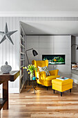 Reading corner with yellow wingback chair and matching footstool