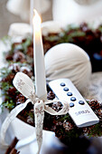 Advent wreath with white candle and remote control