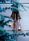 Tealight lanterns hung in garden