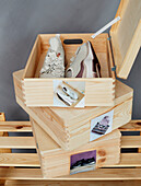 Organiser: wooden boxes for shoes and bags with photos of contents