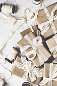 Christmas gifts wrapped in wrapping paper with lace border