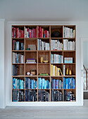 Bookshelf with books sorted by colour