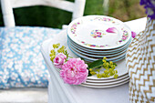 Stack of plates decorated with roses
