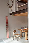 Dining area, gallery above, old skis on the wall
