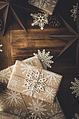 Christmas gifts wrapped in wrapping paper with snowflake motif