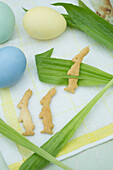 Bunny shaped cookies with ribwort and colored eggs