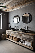 Recycled wood sink base with two counter top sinks in bathroom with grey walls