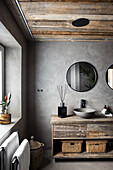Recycled wood washbasin with countertop sinks in bathroom with grey walls