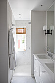 Bright, contemporary bathroom, vanity unit with double washbasin