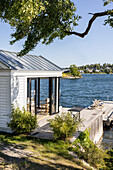 Wooden cottage on the waterfront