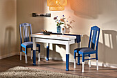Wooden table and chairs redesigned with colors and upholstery fabric