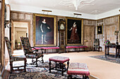 Large Tudor and Jacobean portraits with 17th century upholstered chairs