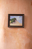 Small painting with landscape motif on clay wall
