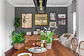 Dining room in boho and modern country style, small art gallery on the wall