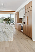 Modern, stylish kitchen with marble island