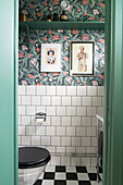 WC with wallpaper in floral design, black and white chequered floor and white tiles