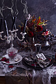 Table decoration with blown out candles for Halloween
